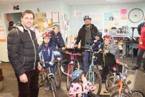 Members of a refugee family getting their bikes through R Community Bike. Photo provided.