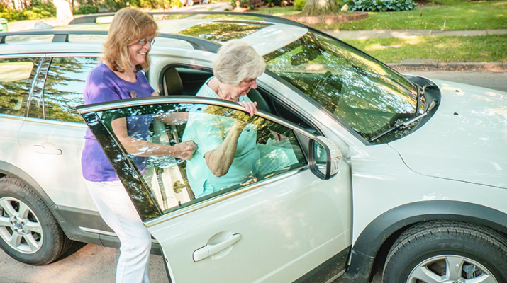 A senior getting a ride with a volunteer at Lifespan. Photo courtesy of Gelfand-Piper Photography.
