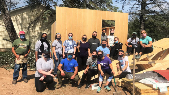 Students at New York Chiropractic College donating their time to build and repair homes through Habitat Humanity of Seneca County.