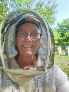 Amy Stringer wearing her bee suit. She is the owner of The North Bee in Webster. Photo provided